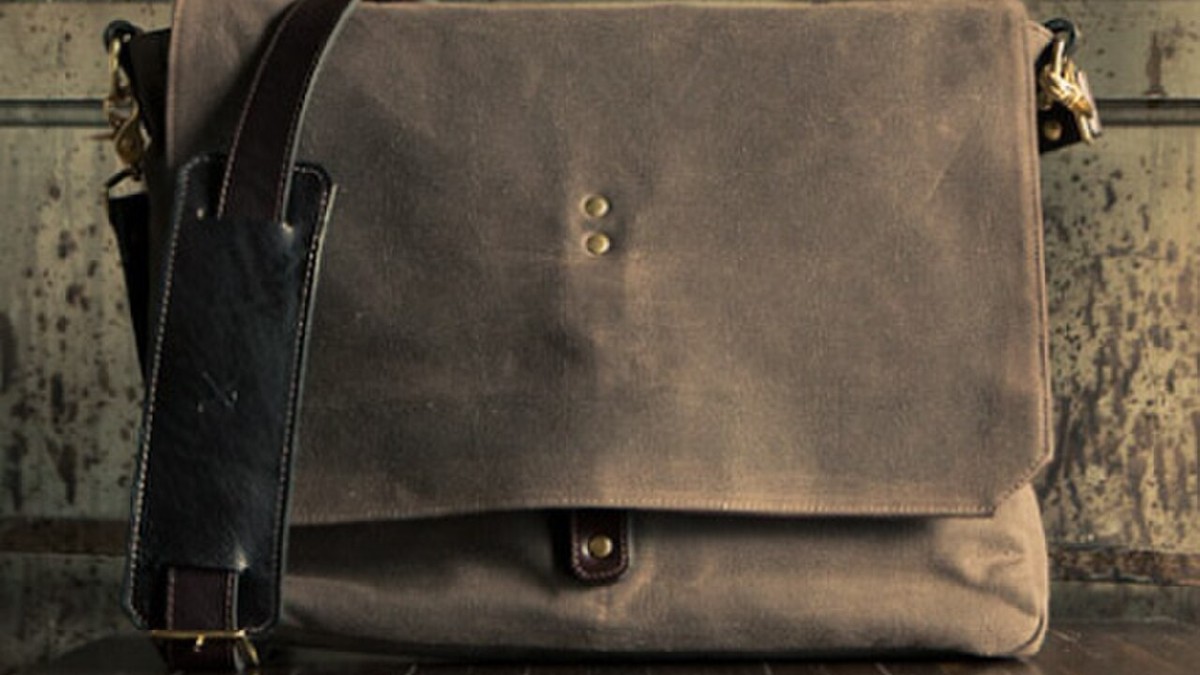 A compact neutral crossbody bag styled with a casual everyday outfit