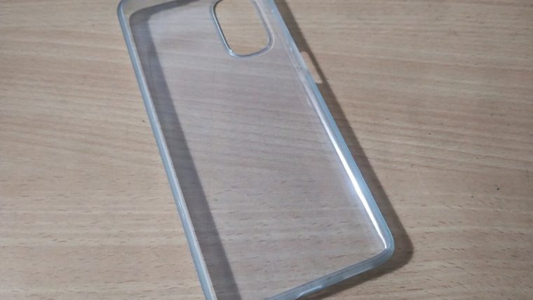 Phone cases, straps, grips, and a stand arranged for compatibility comparison
